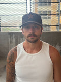 Unstructured black suede buckle-back hat — front view