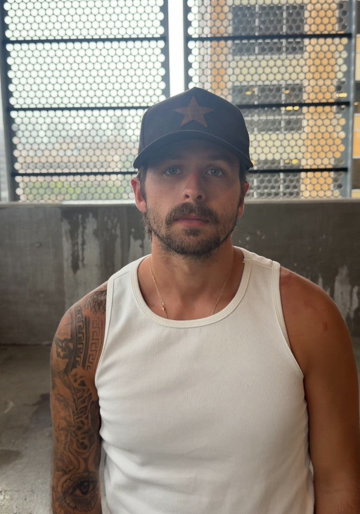 Black suede buckle-back hat — lifestyle
