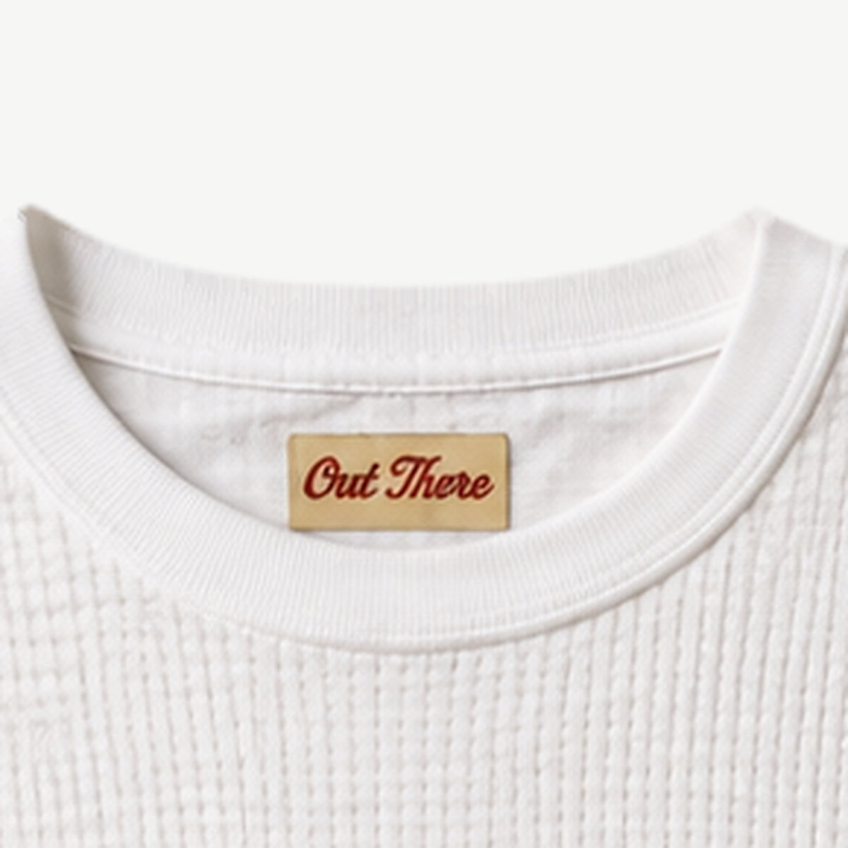 Close-up of the rib crew neck on the White Waffle Script Long Sleeve